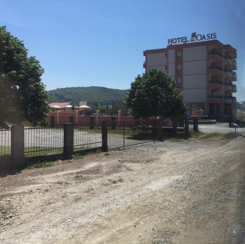Hotel Oasis along a dusty, road resurfacing