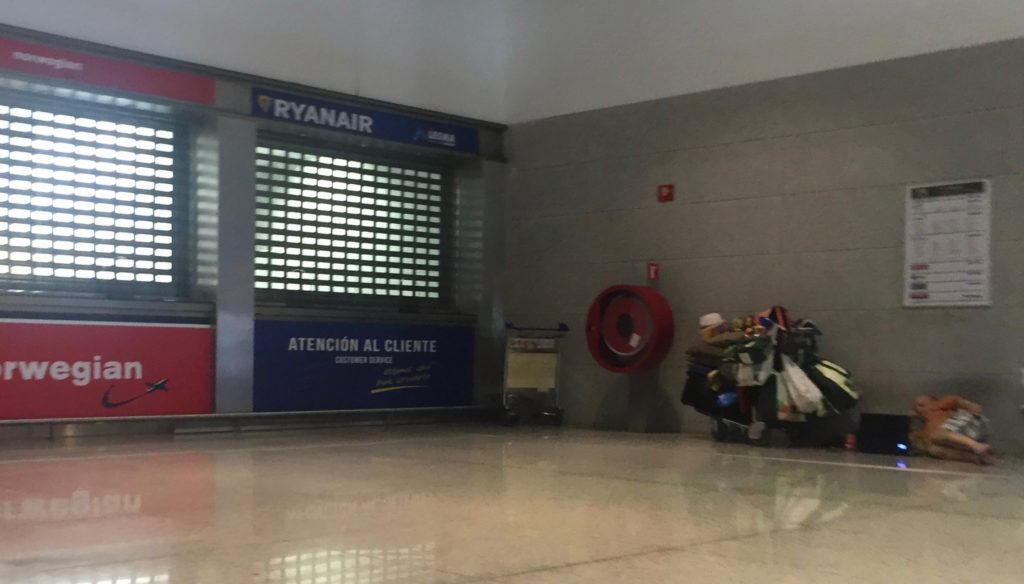 Some traveller getting comfortable on the floor